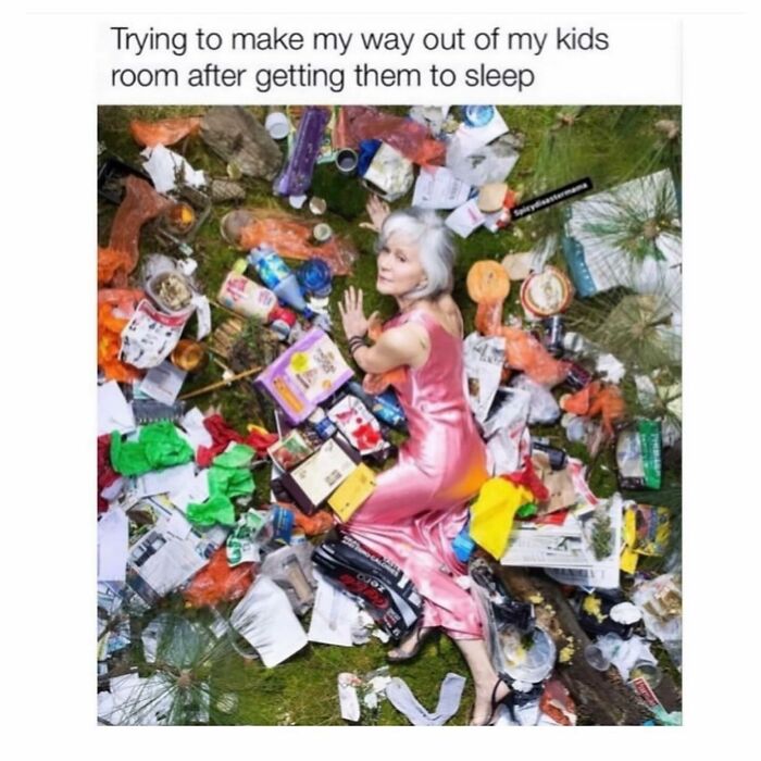 Woman in pink dress lying in cluttered kids room, illustrating chaos in funny parenting memes about real-life challenges.