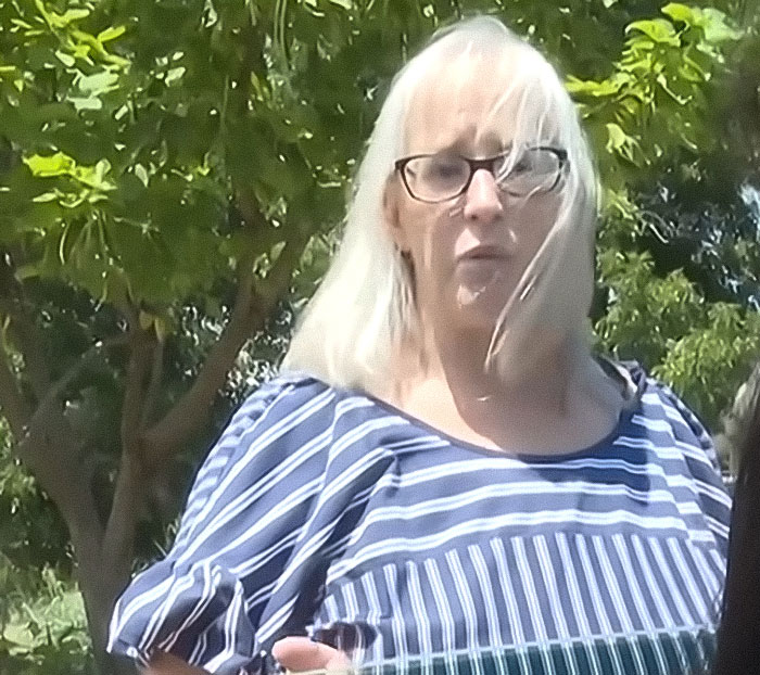 Woman with glasses and white hair outdoors, addressing stepdad and mom felony charges after home birth without medical assistance. Woman with glasses and white hair outdoors, addressing stepdad and mom felony charges after home birth without medical assistance.