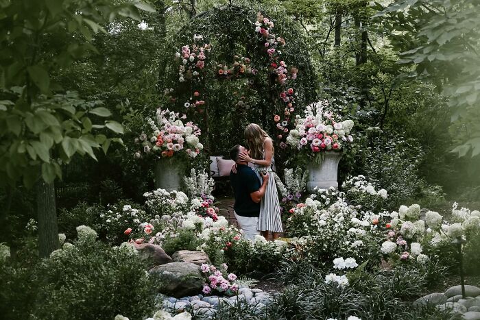 Couple sharing a romantic moment in a lush garden surrounded by flowers, highlighting Travis Kelce’s ex Kayla Nicole buzz. Couple sharing a romantic moment in a lush garden surrounded by flowers, highlighting Travis Kelce’s ex Kayla Nicole buzz.