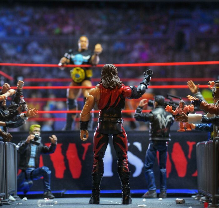 Wrestling action figures in a ring surrounded by cheering crowds, illustrating the theme of shopping collectibles.