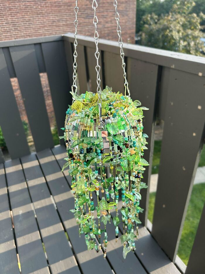 Handcrafted hanging decoration with green beads and leaves, a cool creation people shared for others to admire.
