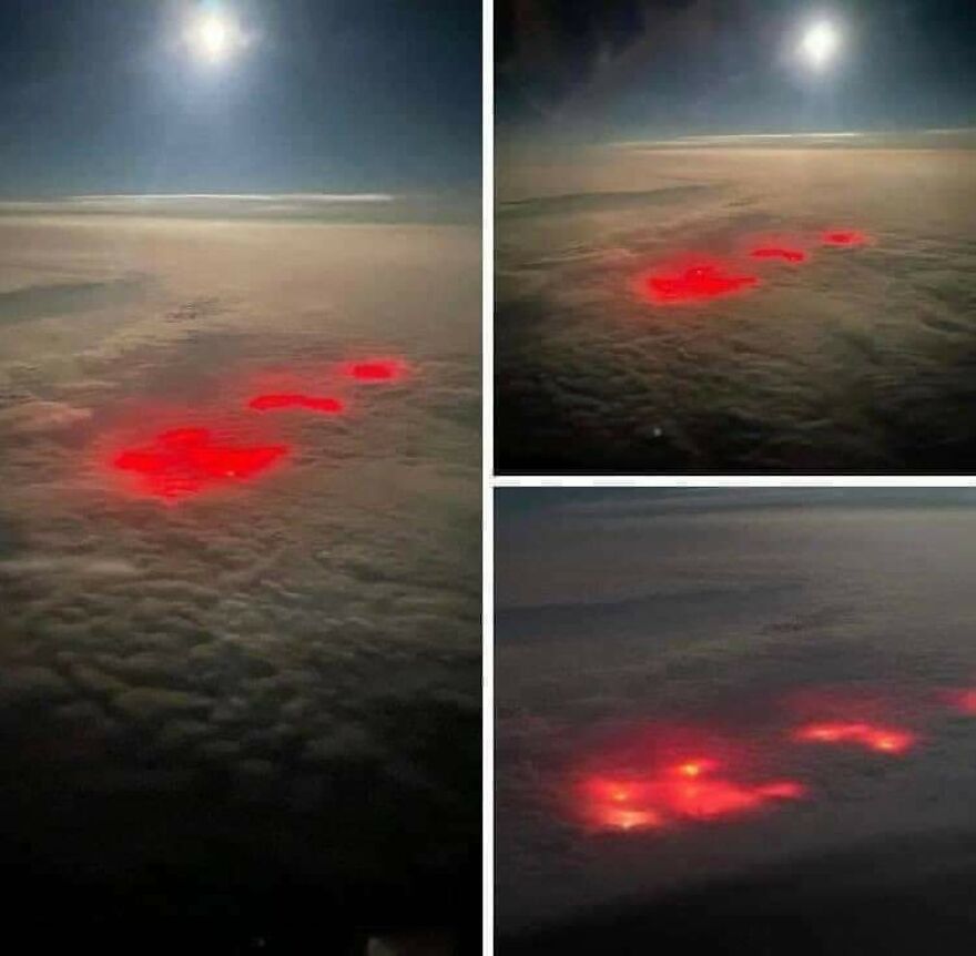 Aerial nighttime view of glowing red patches on a cloud layer, captured for d**n that’s interesting online community.