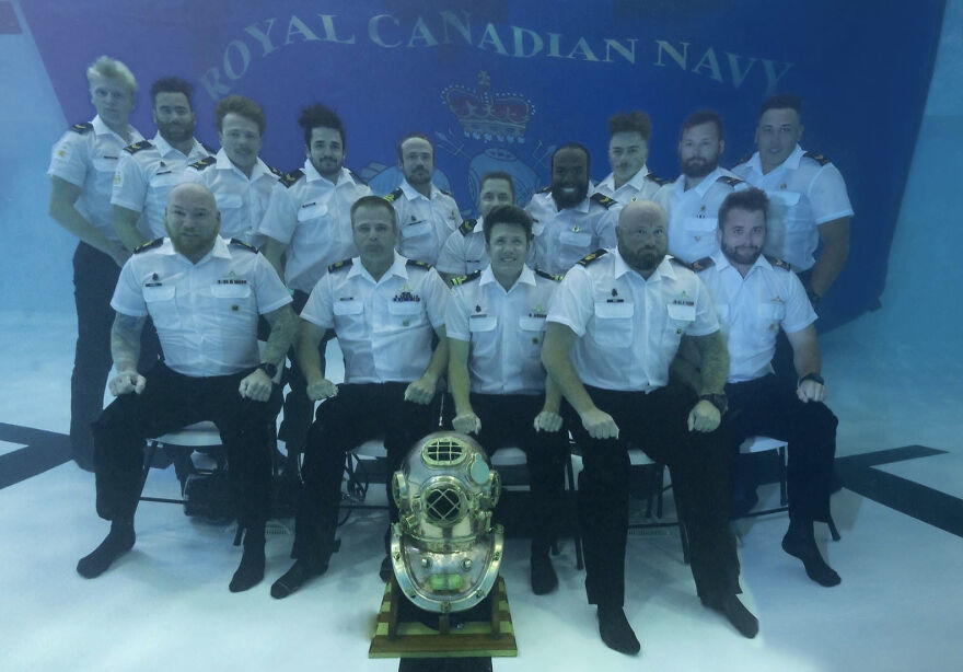 Royal Canadian Navy team posing underwater in uniform with vintage diving helmet as part of interesting online community posts.