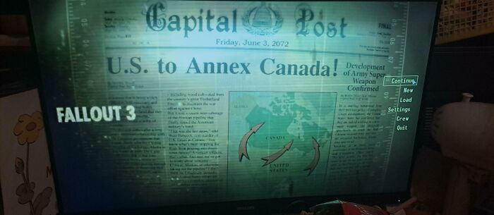 Screenshot from Fallout 3 showing a futuristic newspaper headline predicting U.S. annexation of Canada.