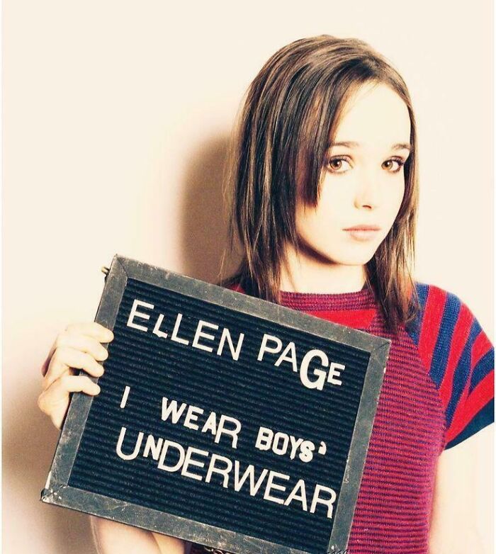 Ellen Page holding a sign, with a nostalgic style reflecting aged like wine predictions and accuracy.