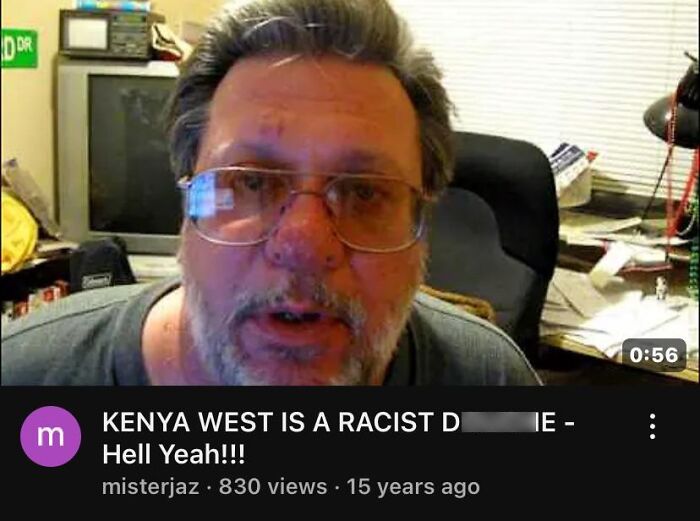 Man with glasses and gray hair in a cluttered room, discussing predictions so accurate like aged wine in a casual setting.