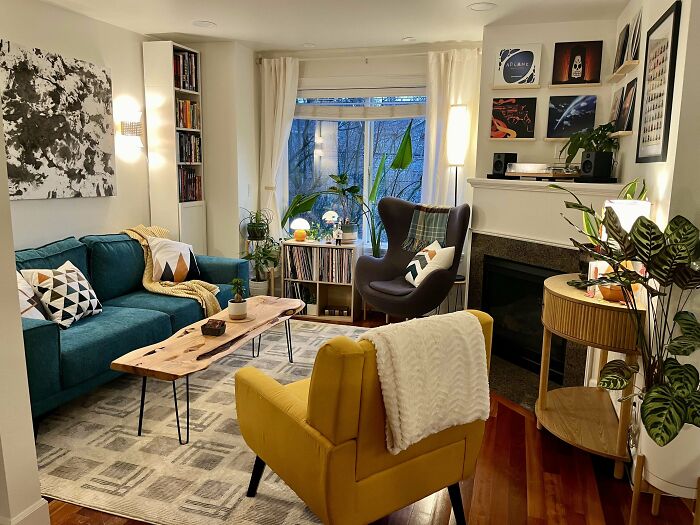 Cozy living room corner featuring colorful furniture, plants, and personalized decor in a proud home decorating space.