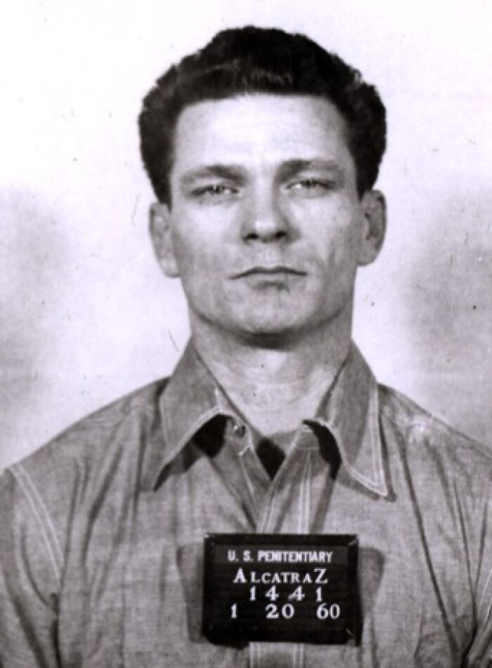 Mugshot of an inmate at Alcatraz prison dated 1960, showing the harsh reality of life on Alcatraz island.