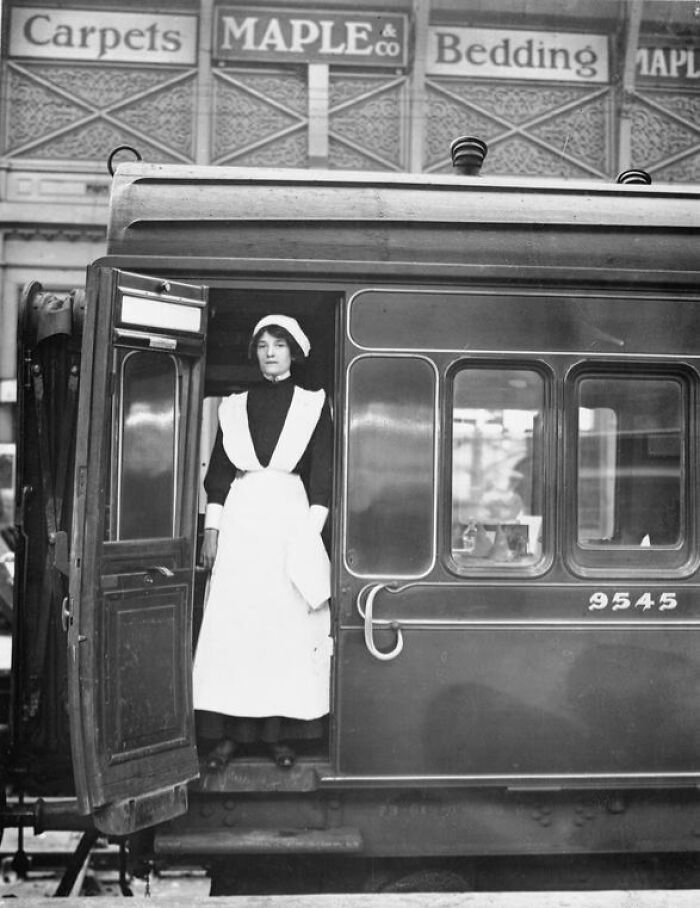 Woman in early 1900s nurse uniform standing at train door, illustrating how women changed everything during WWI.