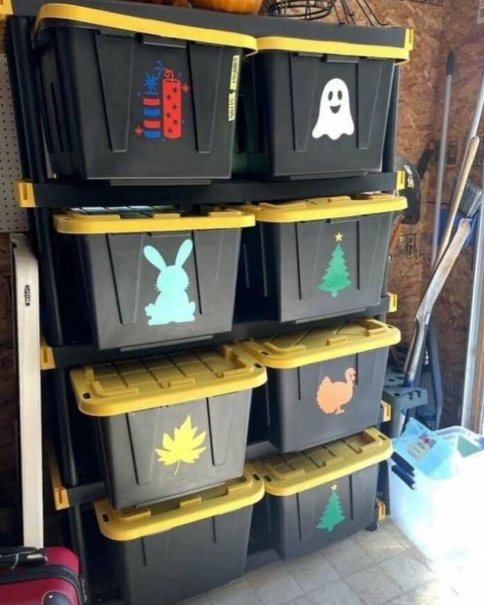 Stacked storage bins with seasonal and holiday icons, showcasing crafty organizing ideas from a popular Instagram account.