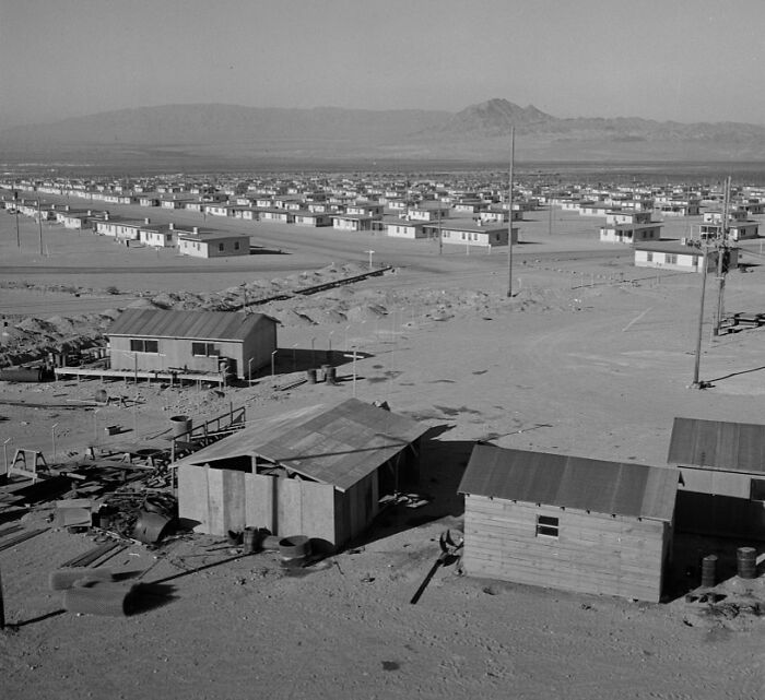 Early stages of the birth of Vegas showing rows of simple homes and desert landscape in a historic black and white photo.
