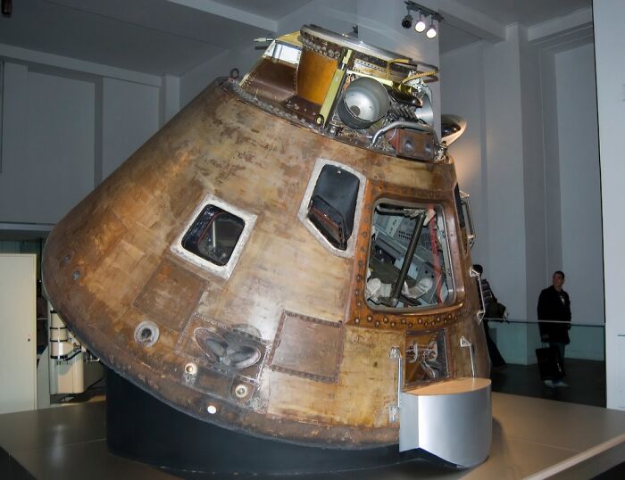 Space capsule exhibit in a museum showcasing a record-breaking invention that moves at mind-blowing speeds.