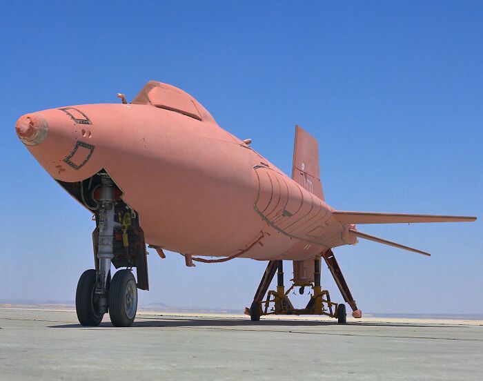 Prototype aircraft on runway showcasing record-breaking inventions that move at mind-blowing speeds under clear blue sky conditions.