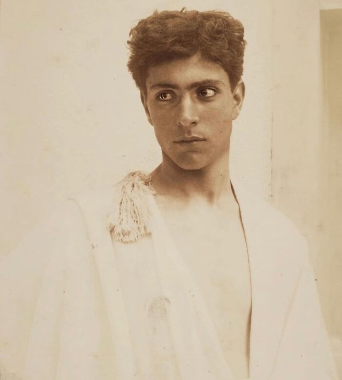 Young Victorian man in vintage attire looking thoughtfully to the side, embodying handsome Victorian men style.