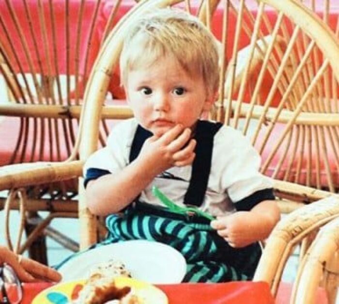 Young child sitting in a wicker chair with a concerned expression, related to chilling disappearances from the ’90s.