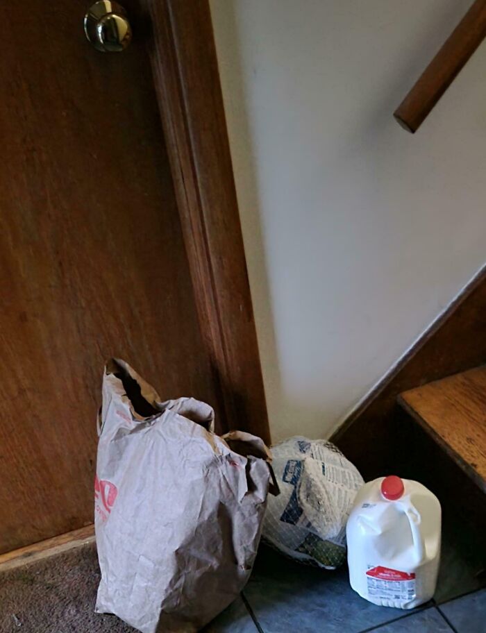 Paper bag, wrapped turkey, and a gallon of milk left at the doorstep by wholesome kind neighbors. Paper bag, wrapped turkey, and a gallon of milk left at the doorstep by wholesome kind neighbors.