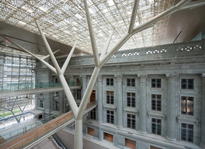 Interior view showing contrast between old architecture with classical columns and modern architectural structural elements.