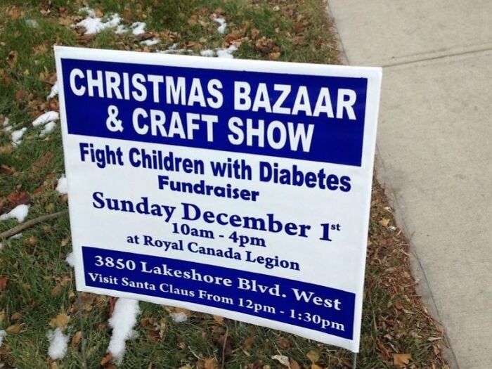 Christmas bazaar and craft show sign with fundraiser details promoting humor and lighthearted messages.