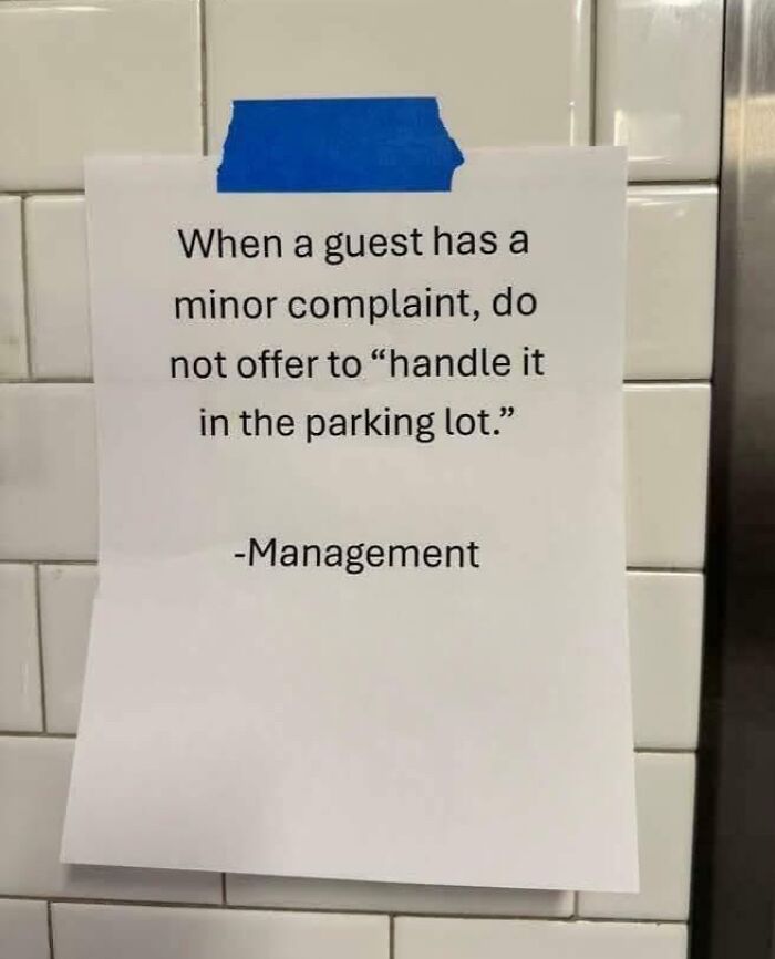 Funny random note taped on wall advising not to handle minor guest complaints in the parking lot as a humorous life reminder.