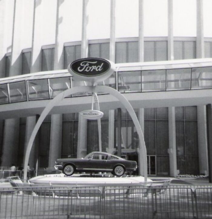 Black and white photo of a vintage Ford car displayed outdoors emphasizing savage roasts and comebacks concept.