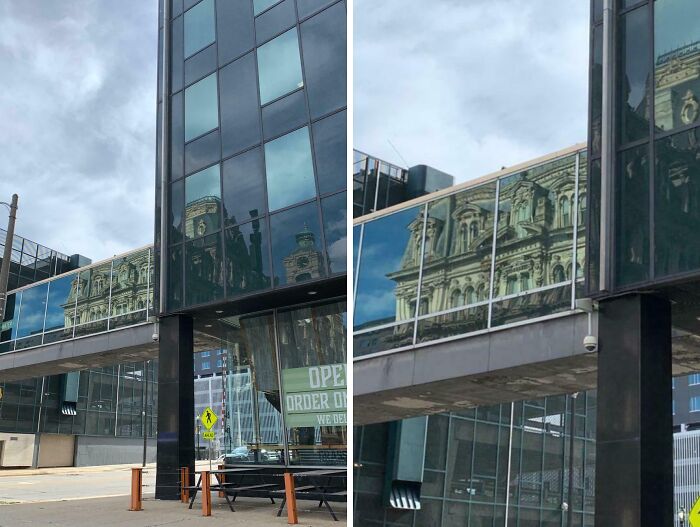 Reflection of old architecture on the glass facade of a modern building showcasing old versus modern architecture contrast.