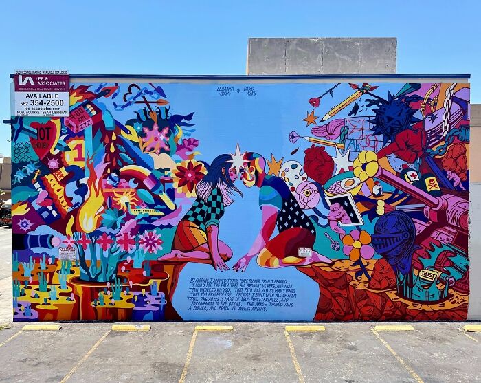 Vibrant mural by Colombian artist SakoAsko blending fantasy and reality with colorful, surreal imagery on an urban wall.