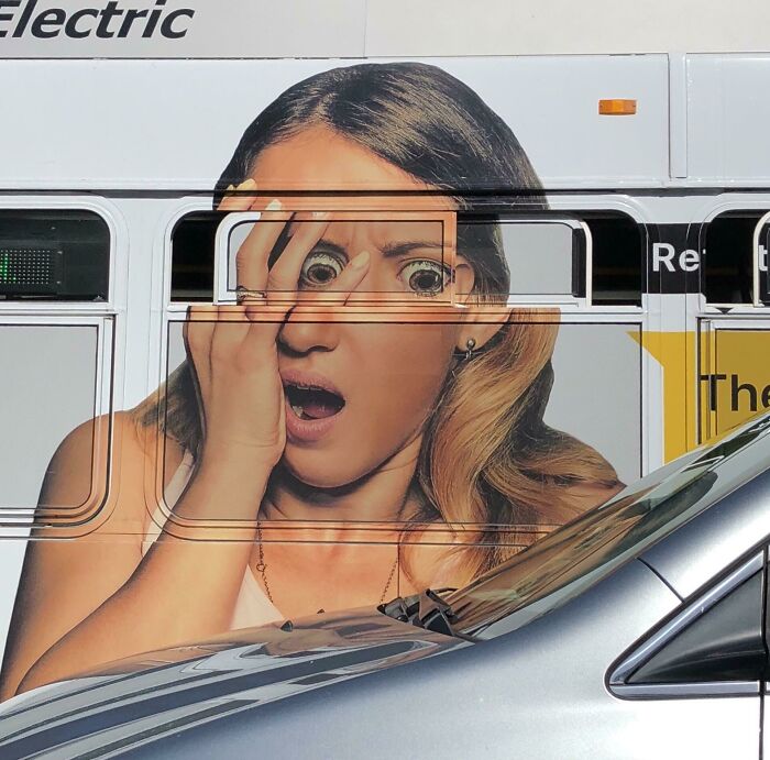 Bus ad placement fail showing a surprised woman whose eyes align awkwardly with bus windows, creating a humorous advertising placement fail.
