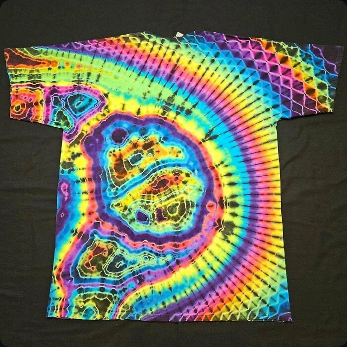 Tie-dye shirt with vibrant rainbow colors and intricate patterns, showcasing something people made so cool to share