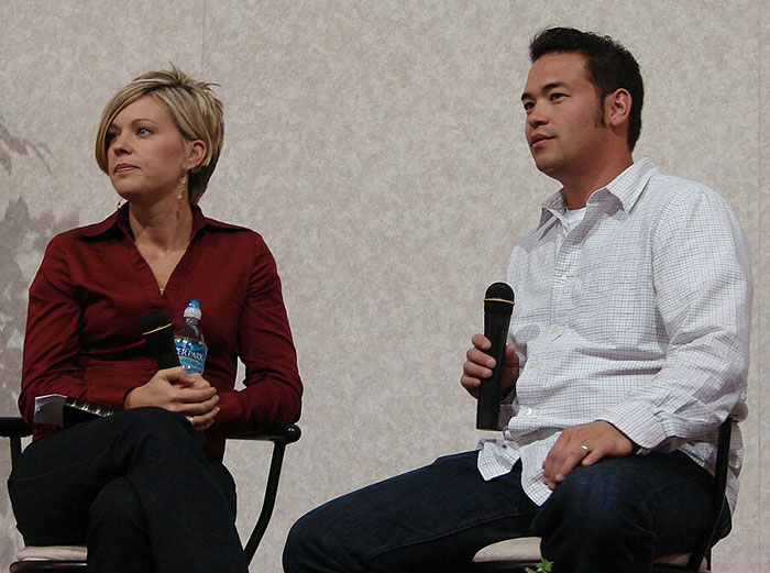 Kate and Jon Gosselin seated with microphones during a public discussion about family and personal challenges. Kate and Jon Gosselin seated with microphones during a public discussion about family and personal challenges.
