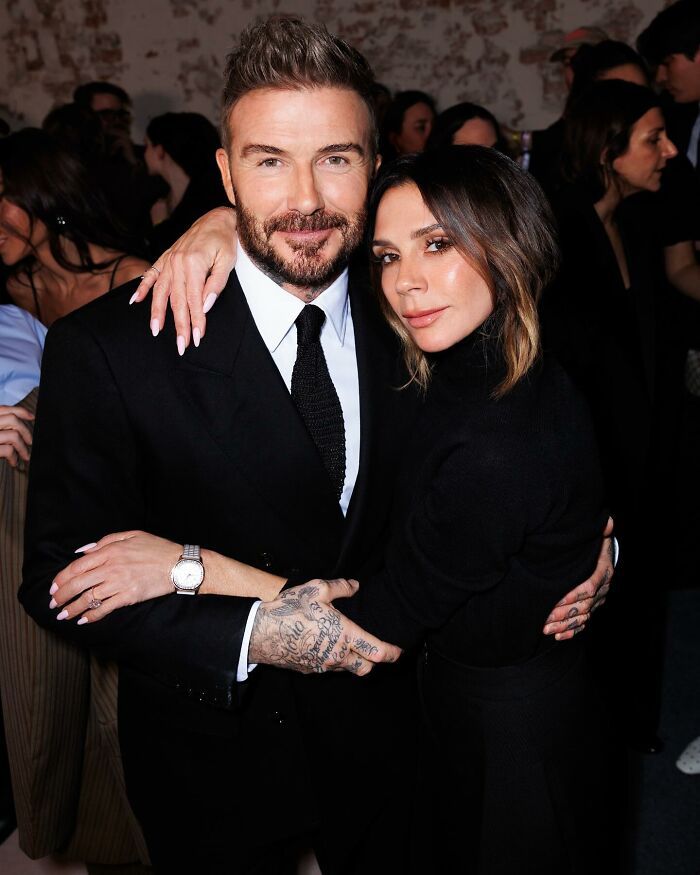 David and Victoria Beckham posing closely at an event, reflecting reactions to son Brooklyn's vow renewal speech. David and Victoria Beckham posing closely at an event, reflecting reactions to son Brooklyn's vow renewal speech.