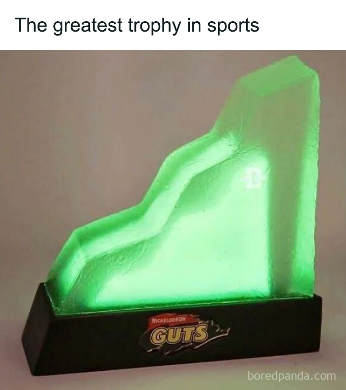 Green Nickelodeon GUTS trophy displayed on a black base, evoking strong 90s kids nostalgia and childhood memories.