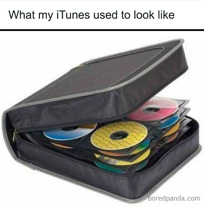 Compact disc case filled with colorful CDs, representing 90s kids nostalgia and old-school music collections.