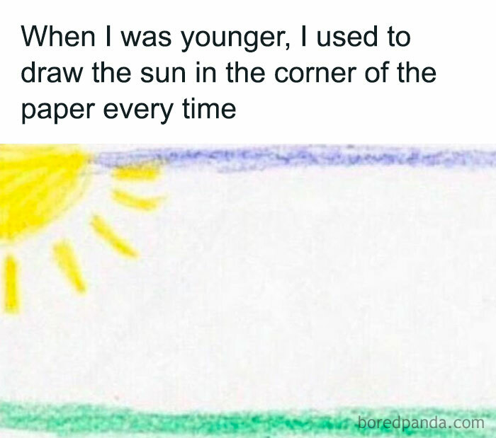 Child’s drawing of a yellow sun in the corner of paper with nostalgic 90s vibes and simple crayon colors.