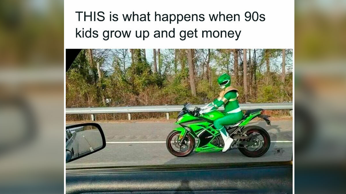 Person dressed as Green Power Ranger riding a green motorcycle on road, capturing 90s nostalgia vibe.