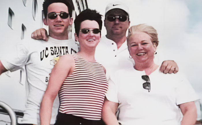 Group of four people smiling on a cruise ship deck, related to Amy Bradley cruise ship mystery and journalist investigation. Group of four people smiling on a cruise ship deck, related to Amy Bradley cruise ship mystery and journalist investigation.