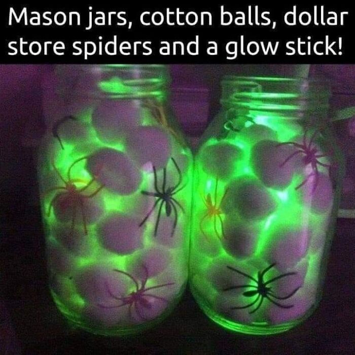 Glow stick mason jars filled with cotton balls and plastic spiders, showcasing an ingenious crafty idea for decoration.