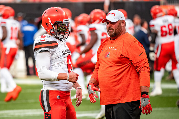 Cleveland Browns football players warming up on the field, showcasing moments of savage roasts and comebacks in sports.