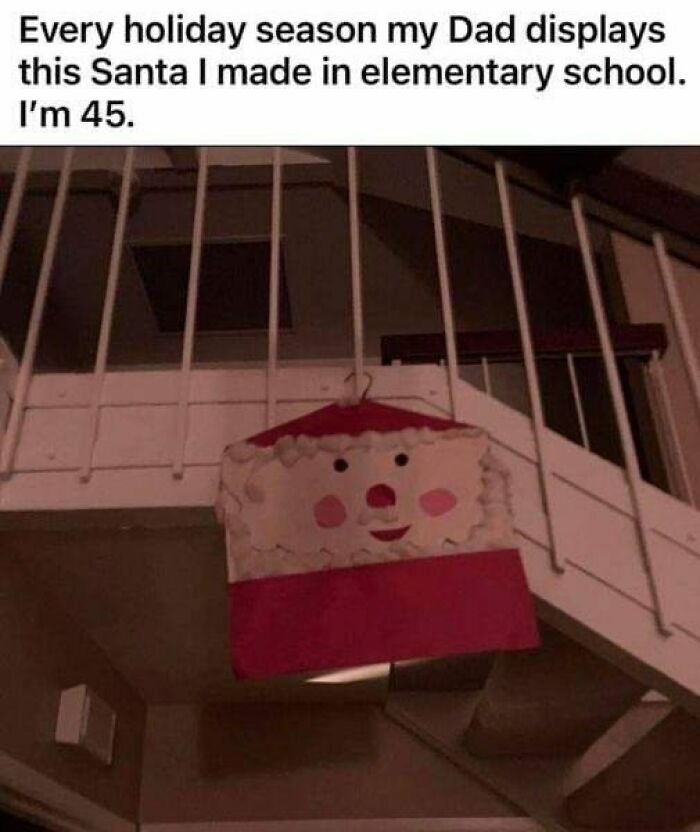 Handmade Santa decoration hanging on a staircase railing, showcasing ingenious crafty ideas from a popular IG account.