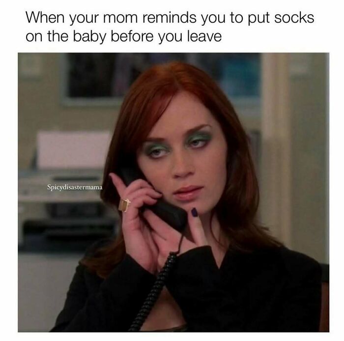 Woman with red hair on phone looking tired, illustrating a funny parenting meme about things no parenting book can teach.