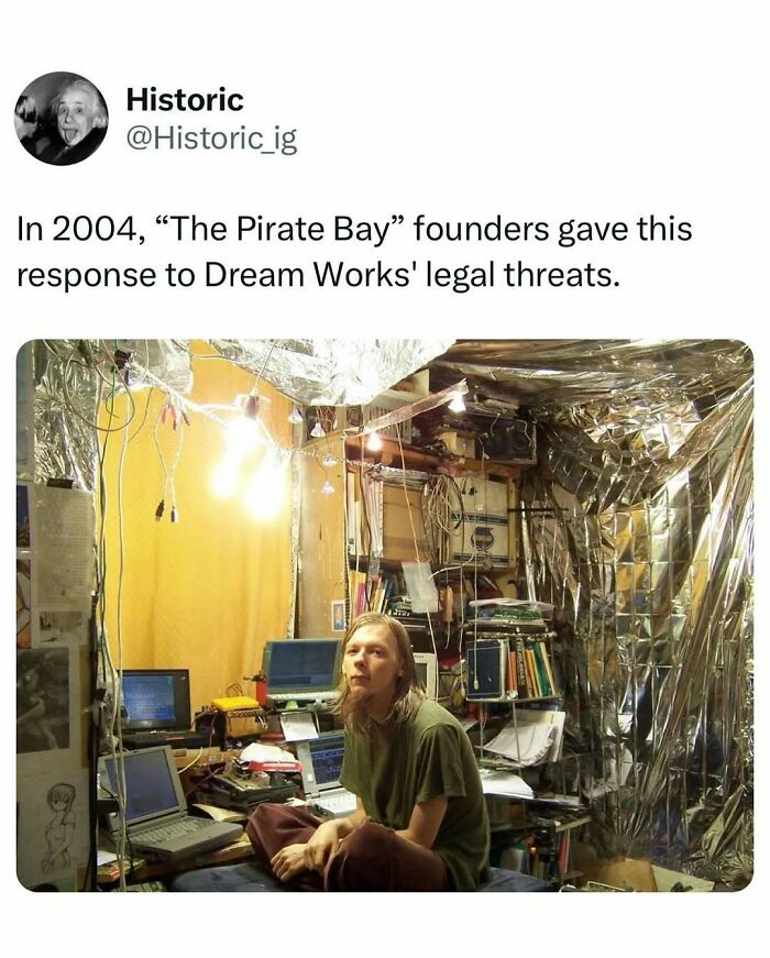 Historic photo of The Pirate Bay founder in a makeshift tech setup responding to legal threats in 2004.