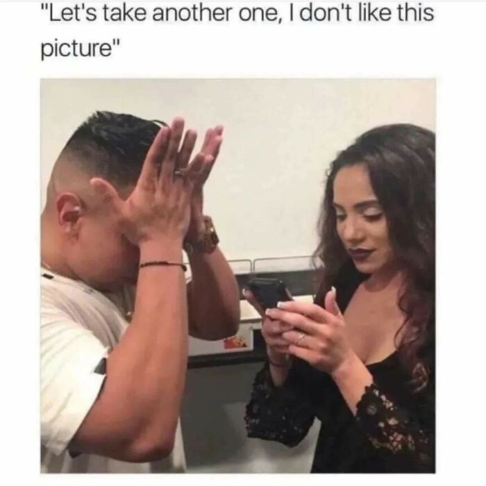 Man covering face in frustration while woman takes a photo, illustrating funny memes that hit the too real part of the brain.