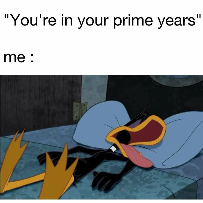 Cartoon character lying exhausted on bed, illustrating a funny moment in hilarious memes for daily laughter and good vibes.