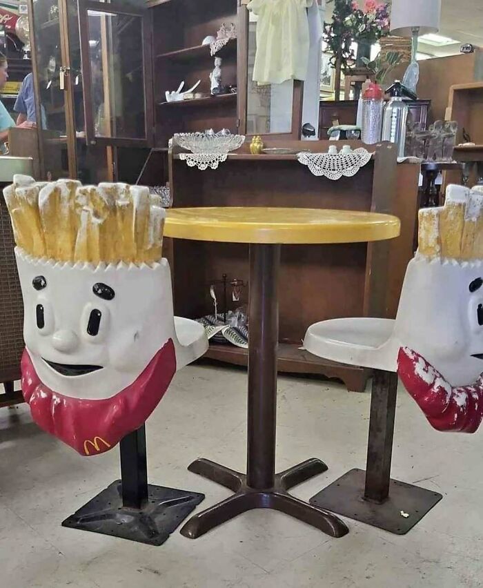 Vintage fast food restaurant seating with animated fry character chairs evoking a nostalgic old-timey closet era vibe.