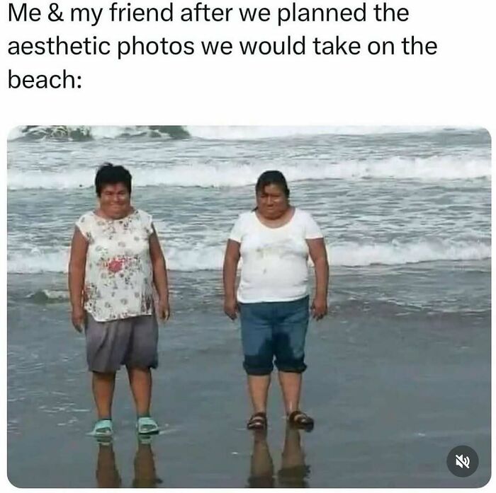 Two women standing sadly in wet clothes on the beach after failed aesthetic photo plans, relatable introvert-worthy memes concept.