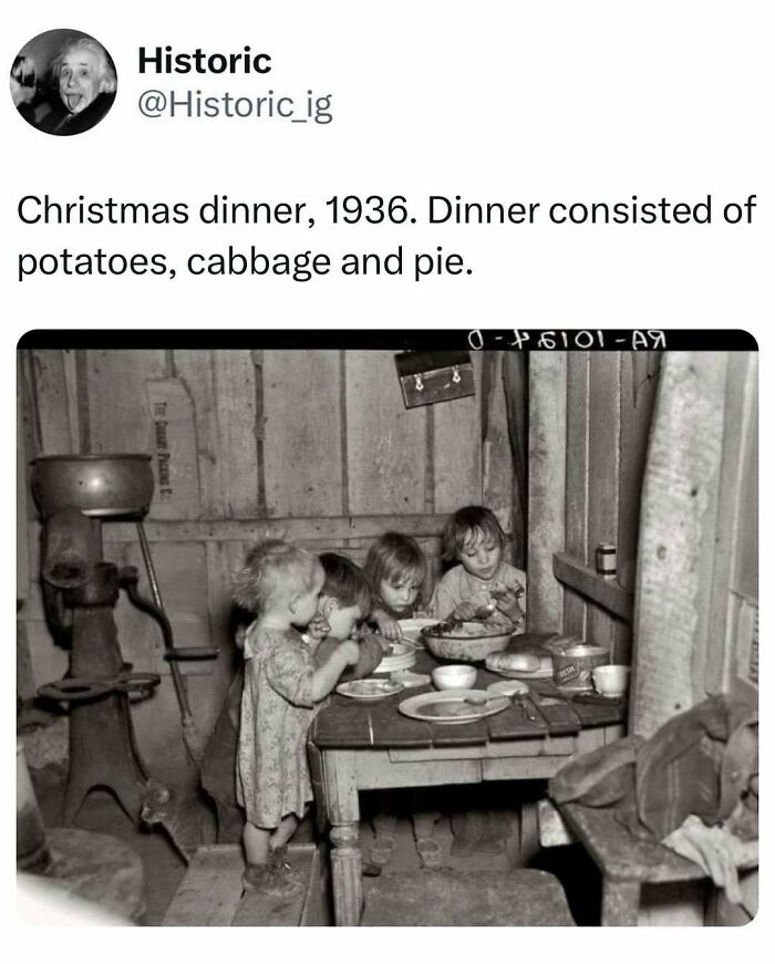Children eating a simple Christmas dinner of potatoes, cabbage, and pie in a historic photo from 1936.