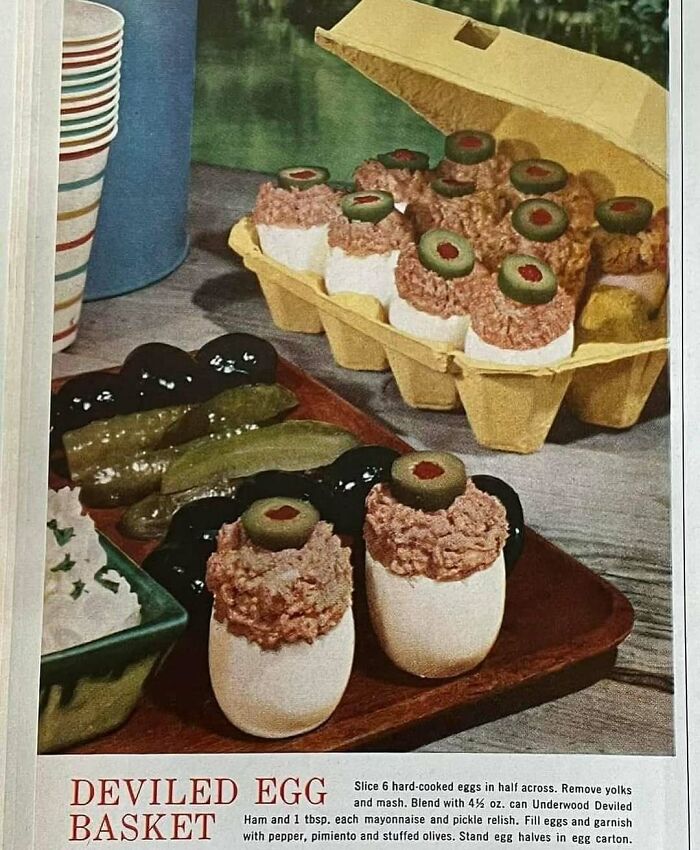 Vintage deviled egg basket with stuffed eggs topped with olives, showcasing classic June Cleavers vintage closet food presentation.