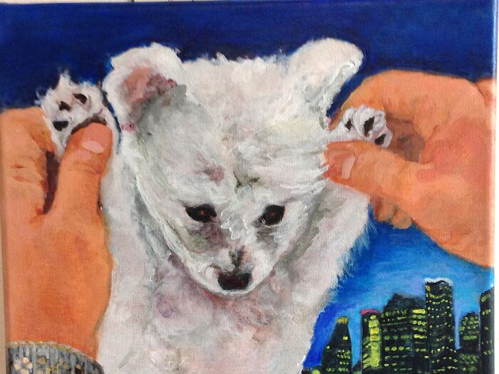 Painting of a white dog pet portrait held by hands with a city skyline background in a 12 by 12 inch artwork.