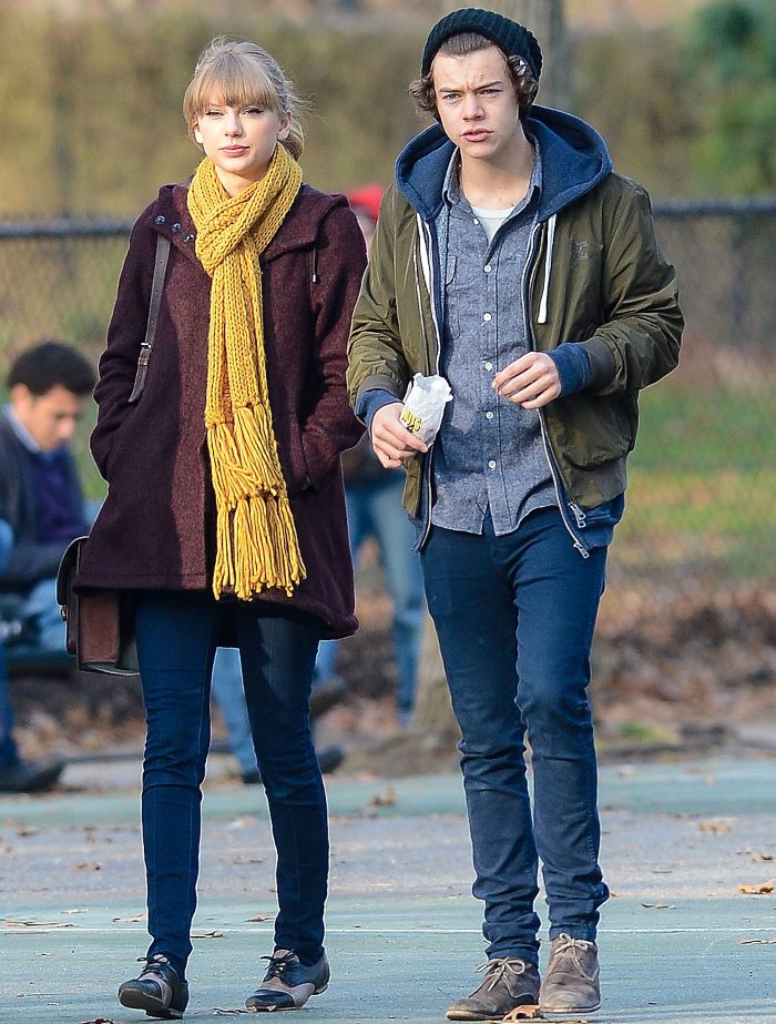 Young woman and man walking outdoors in casual fall clothing, body language expert discusses Travis Kelce traits. Young woman and man walking outdoors in casual fall clothing, body language expert discusses Travis Kelce traits.