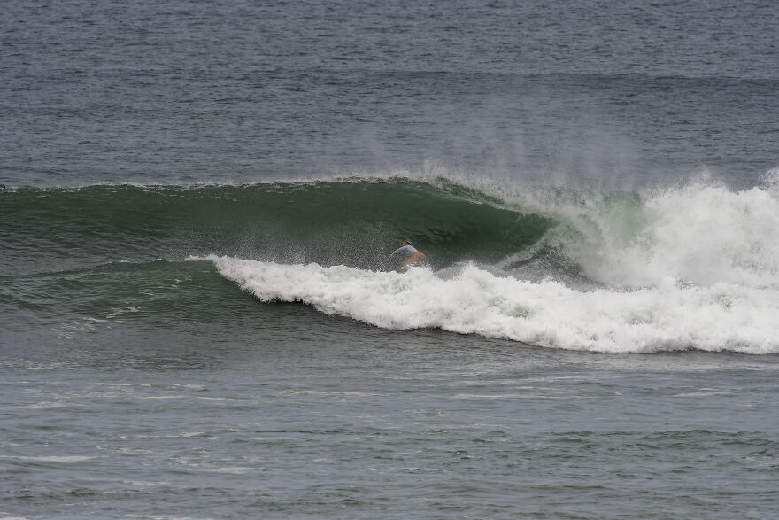 Surfer riding a large wave in the ocean, symbolizing how a one-way flight to Australia changed life and debt. Surfer riding a large wave in the ocean, symbolizing how a one-way flight to Australia changed life and debt.