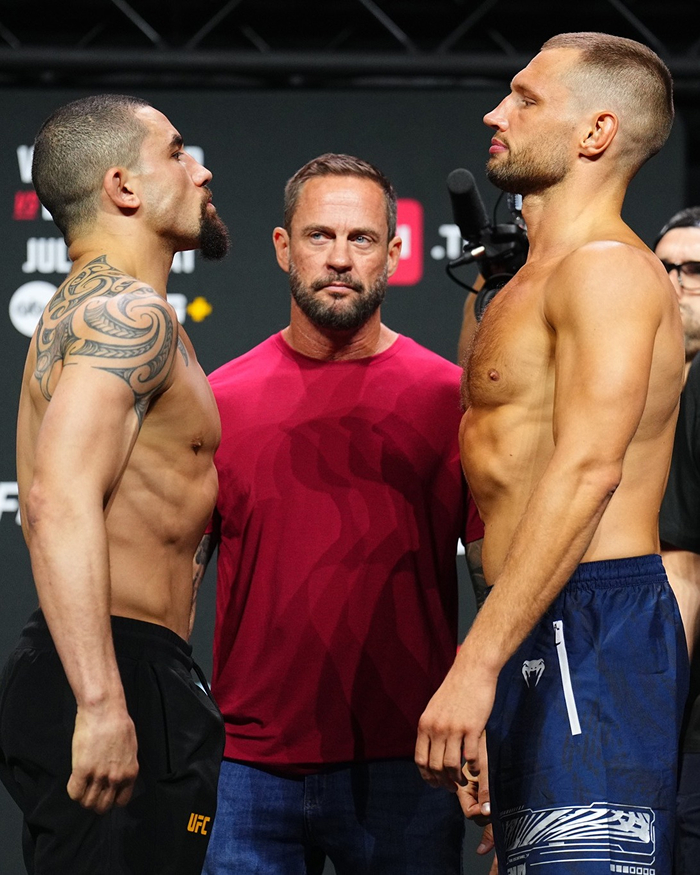 Two UFC fighters facing off during weigh-in as Dana White's net worth growth with UFC pay-per-view events is highlighted. Two UFC fighters facing off during weigh-in as Dana White's net worth growth with UFC pay-per-view events is highlighted.